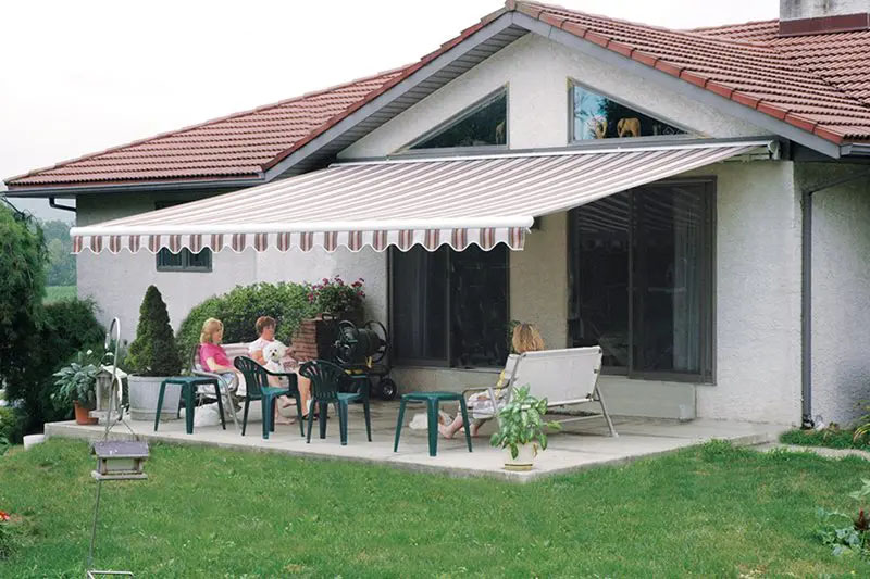 Family Sitting under Betterliving Awning