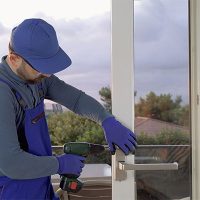 A contractor installing a new door