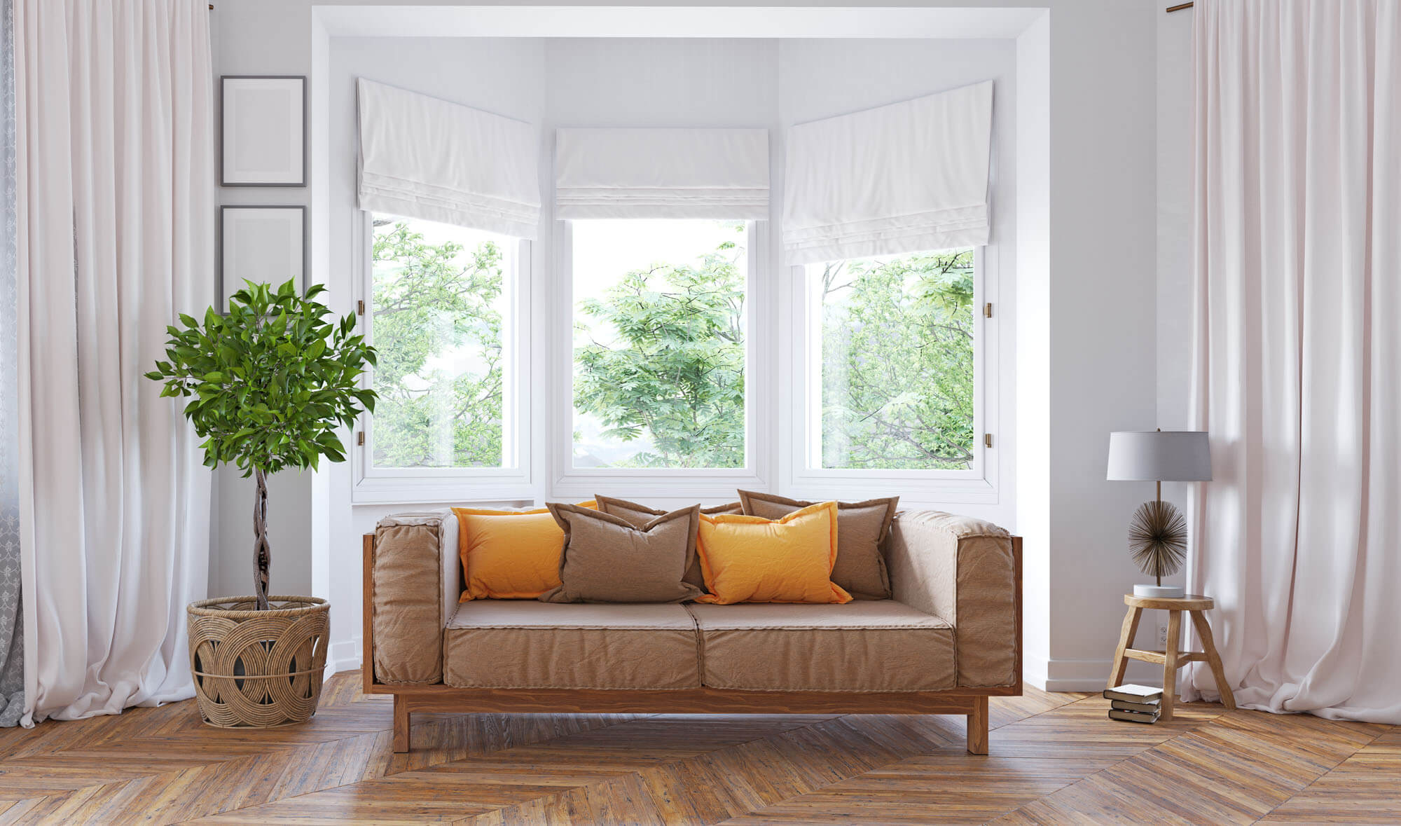 Three large windows behind a sofa in a living room.