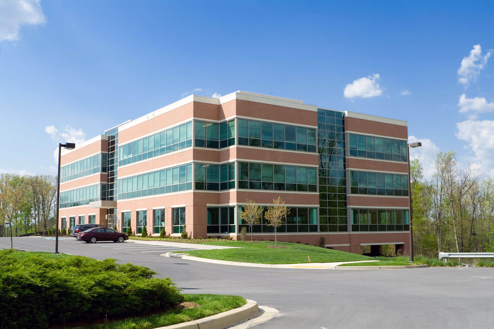 Exterior shot of an office building with many windows.