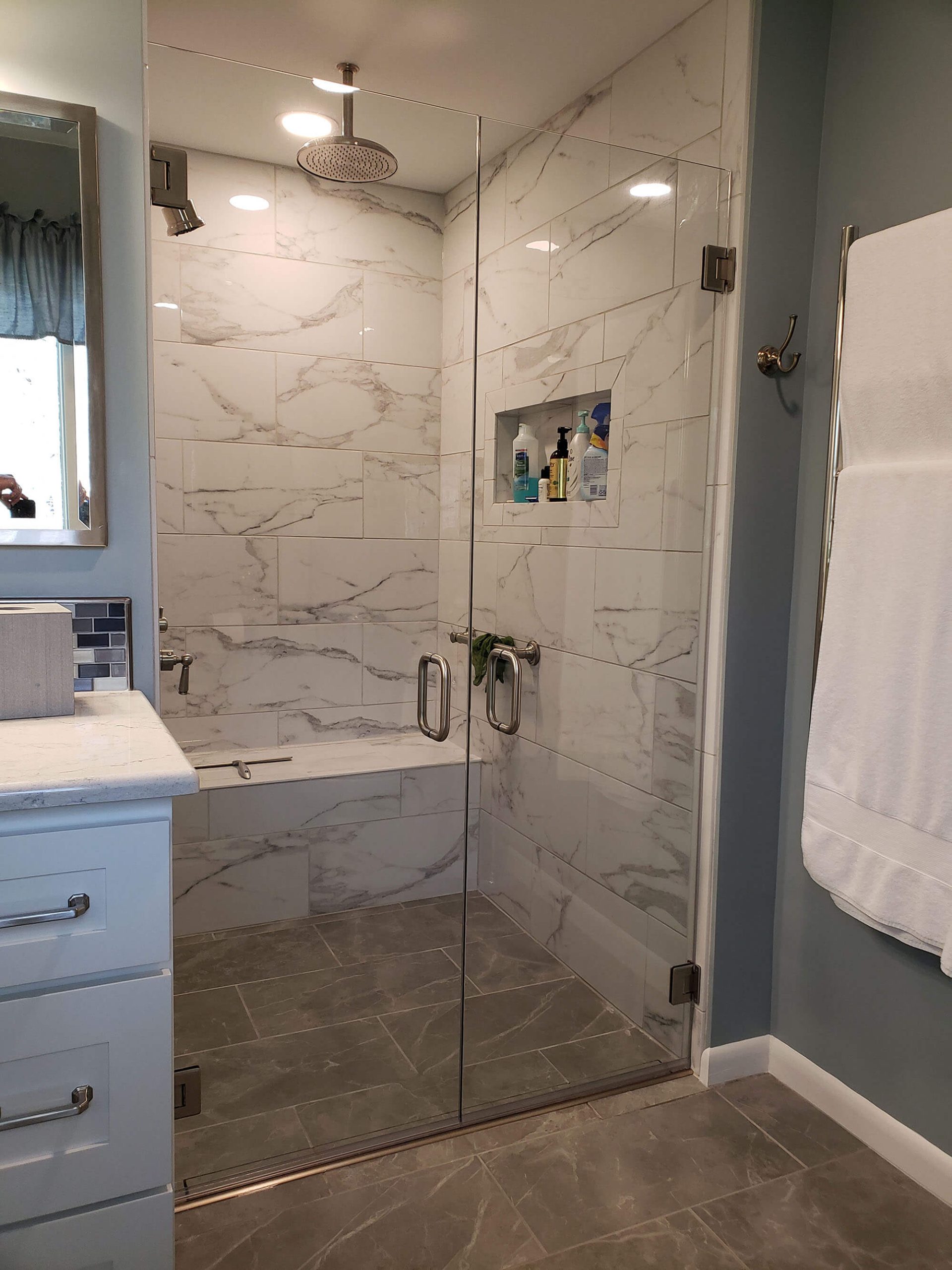 Shower with frameless glass doors